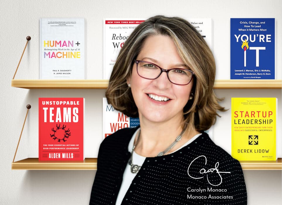 Photo of Carolyn Monaco in front of bookshelves